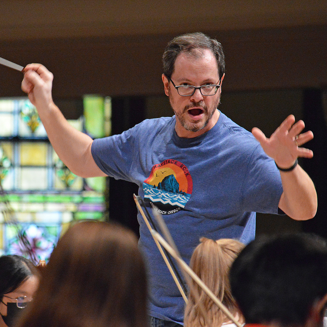 Casey Springstead conducting HYSO rehearsal